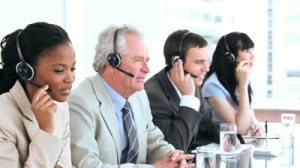 stock-footage-serious-call-centre-agents-talking-with-headsets-in-a-bright-office